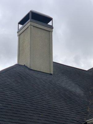 Chimney that was cover in allergy on a stucco siding and removed with  pressure low as a  water hose.