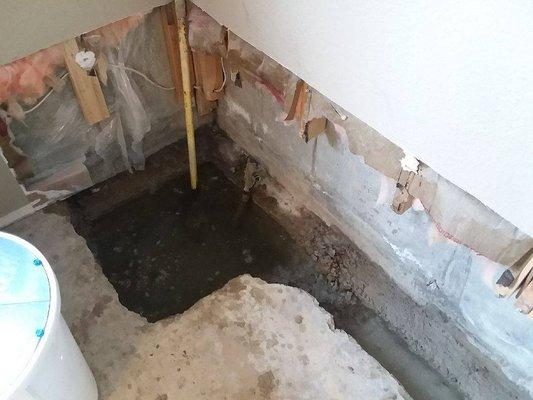 Concrete removed and sump hold filled with water