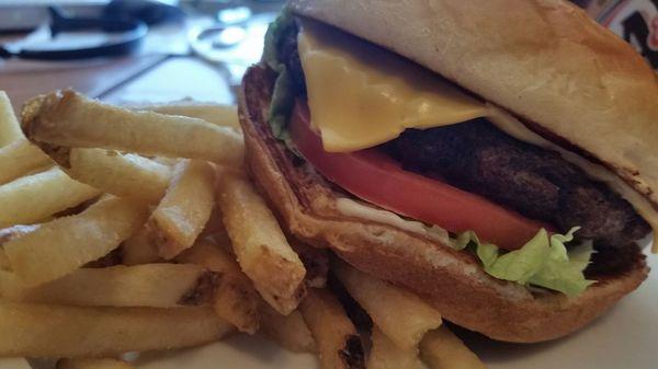 Thick Burger with cheese and a side of fries.