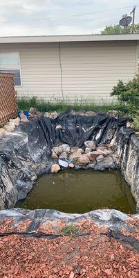 A pond before filling in with dirt and mulch!