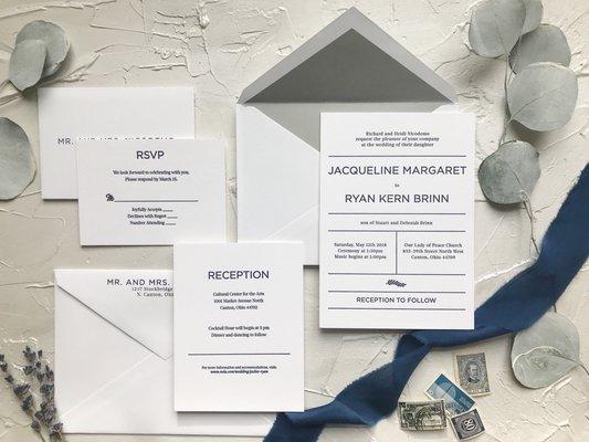 Impress your guests with these classic navy + grey letterpress wedding invitations.