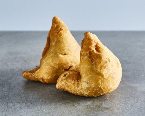 Samosas (v).
 
 Puff pastry stuffed with potatoes and peas.