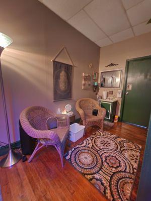 Changing area with private bathroom in massage suite.