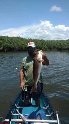 Me and a stud redfish that captain Travis put me on in his canoe trip.