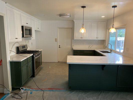 Kitchen after, prior to hardwood installation