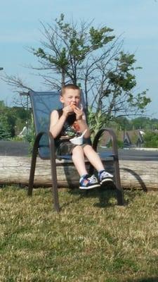 Enjoying his ice cream from sprinkles