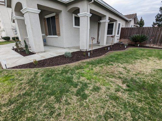 Front yard landscaping
(Mulch, plant installation)