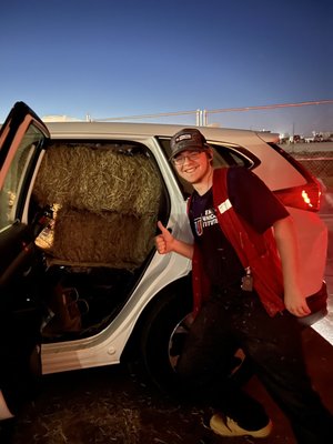 Garrett P. was my big helper tonight. Helped me stuff my car full with 6 large bales of hay.