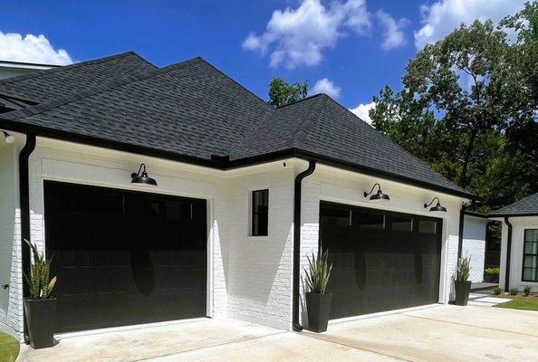 CHI SHAKER STYLE GARAGE DOOR IN BLACK WITH WINDOWS
INSTALLED BY SENTRY GARAGE DOOR TEAM