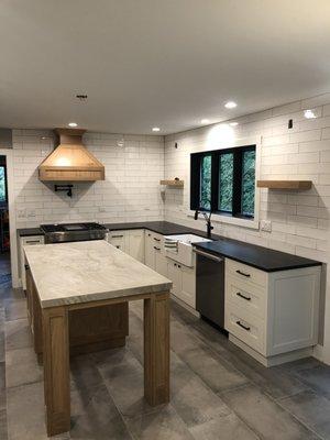 brand new kitchen with new subfloor, tilem lighting, custom cabinets