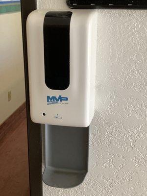 Wall mounted hand sanitizers placed throughout the church