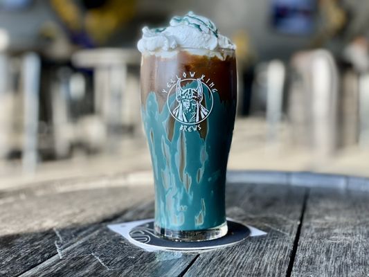 "Cookie Monster": a specialty cold brew latte made with whipped cream and blue cookie butter.