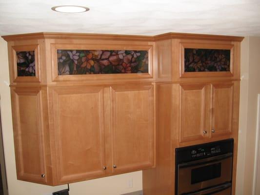 After photo of kitchen cabinets featuring back lit accent design and installation.