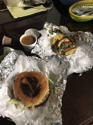 mexican hamburger and a chicharron and barbacoa taco with a free side of charro beans