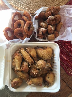 Garlic Parmigian wings, fried mushrooms & onion rings.