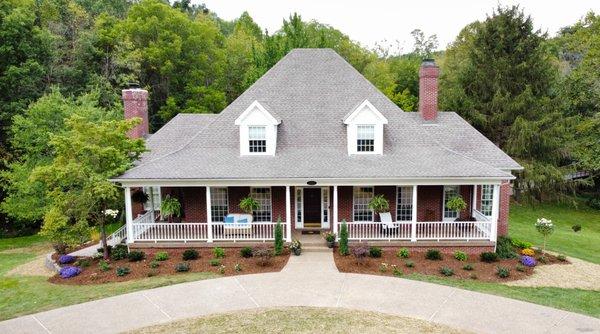 After - Front, including removal of large boxwoods that blocked the drive.