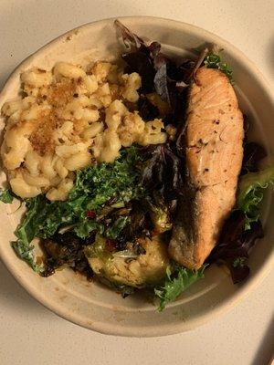 Sushi-Grade Salmon with mixed greens. Mac and Cheese (VG), Kale Caesar, and Maple-Sriracha Brussels Sprouts (V, GF) as sides.