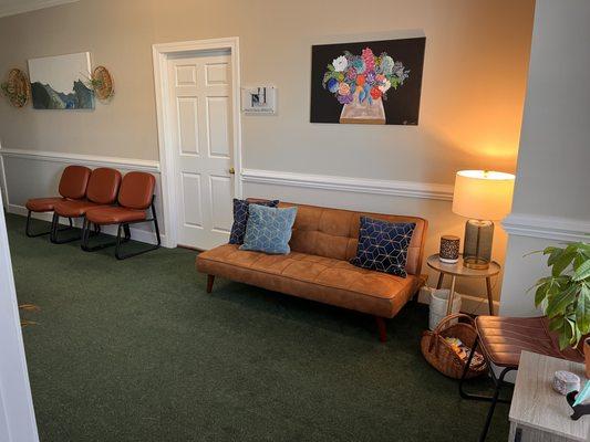 You enter to our lovely waiting room with a wonderful associate, Gussie, to greet you!