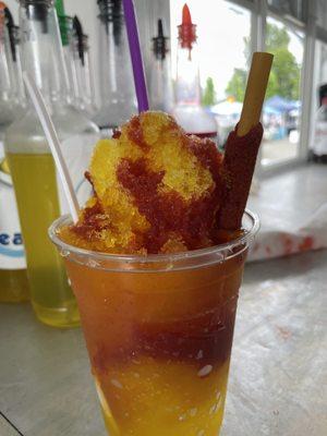 Mangonadas. Mango purée, Chamoy, Chamoy Stick, and Tajin.  Yummy Orange colored drink from the orange  Shave Ice Shack!