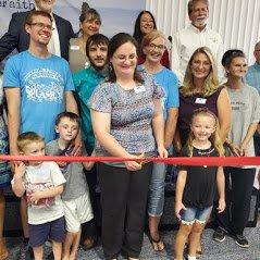 Red Ribbon Cutting for the Grand opening.