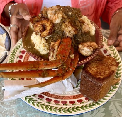 Crab cluster, shrimp, and grits with grilled cornbread