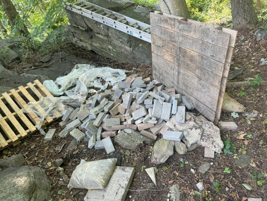 They were to stack bricks neatly on a spot on the property