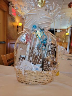 Gift basket w chocolate dipped champagne bottle, personalized bars,chocolate covered pretzels,twinkies, funny bones,almonds,truffles, etc.