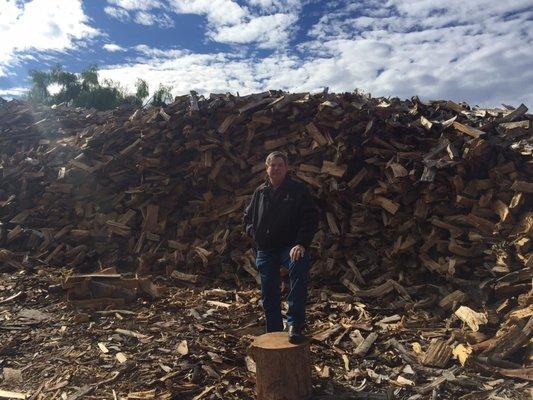 Our owner Rich with a stack of split firewood!