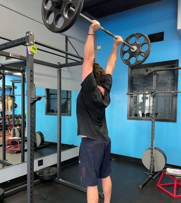 One of our clients pushing 135lbs overhead with ease.