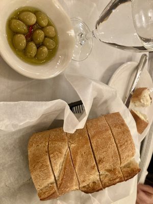 Bread service - high quality olives. Crispy yet soft loaf.