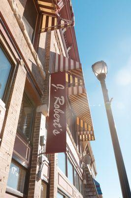 View of the outside sign on the historic J. Robert's Menswear store, a locally-owned men's clothing and tuxedo rental store in Elkhorn, WI