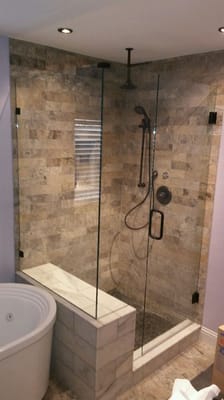 Frameless shower enclosure.