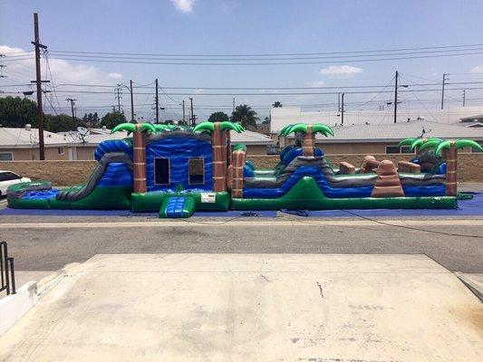 Are 68 foot tropical blue crush obstacle course with four slides!