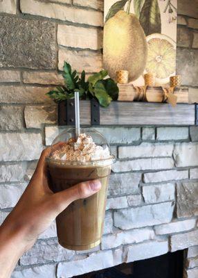 The iced Chai latte with whipped cream