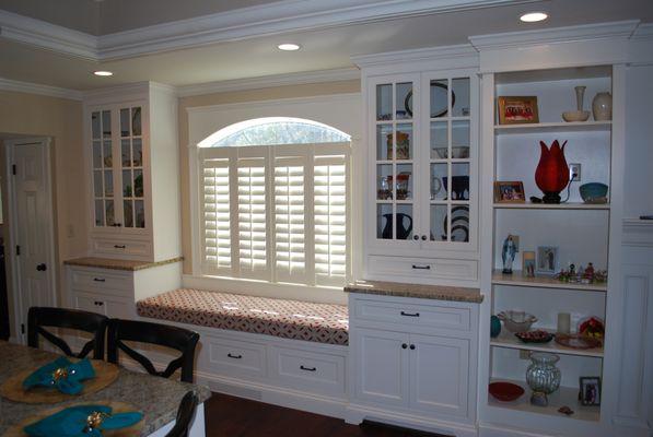 Plantation shutters under arched window