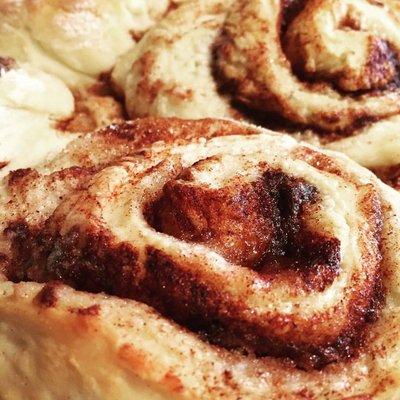 homemade cinnamon rolls with warm maple frosting