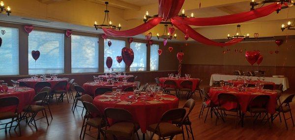 This is our Dining Room . Beautiful room with a wall of windows, hardwood floors and beautiful chandeliers.