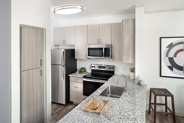 Beautifully renovated interiors with stainless steel appliances