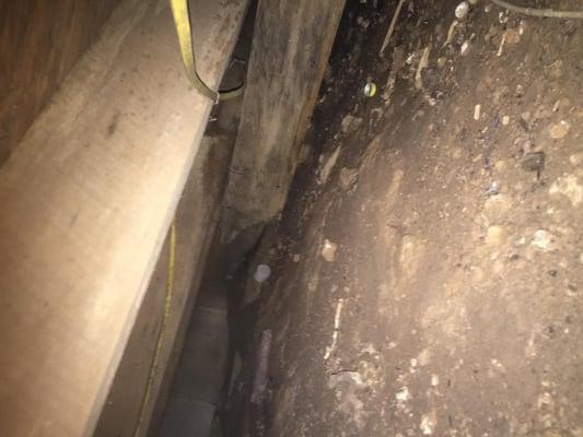 This is a picture of a girder under a home that had broken and fell to the ground. I noticed the floor in  front of the door ...