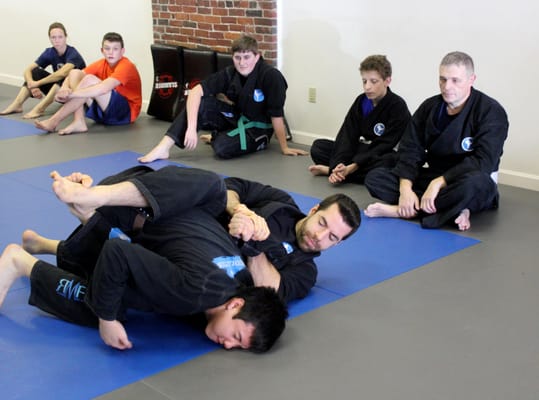 Demonstrating a "kimura" shoulder lock to the teen/adult class