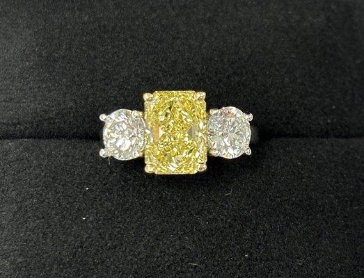 3ct. intense fancy yellow earth mined diamond, with matching natural 1ct diamond accents.