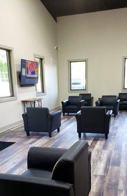 Clean, spacious waiting area with comfortable seating.