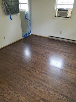 RED OAK HARDWOODS INSTALLED, SANDED, AND REFINISHED USING A PROVINCIAL STAIN W/ A GRAY ACCENT