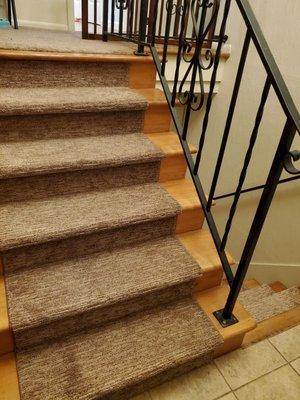 Stairs into my split level home. Dings are covered, and I can still show off the pretty wood.