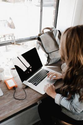 A young woman learning about computer science.