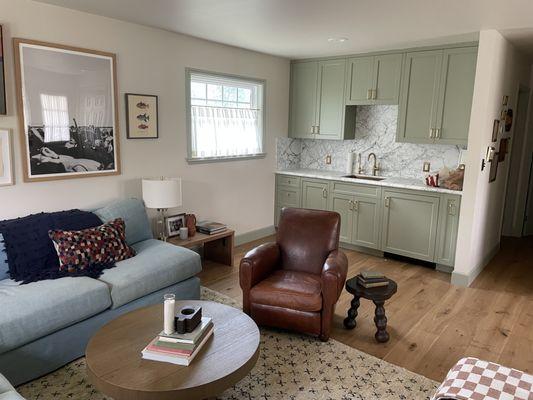 Cozy farmhouse common room with custom wet bar.