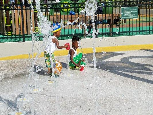 The birthday boy and his brother playing in the spray park.