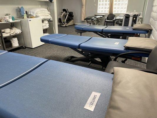 Hi-low treatment tables for easy on and off access and manual therapy, we constantly sanitize