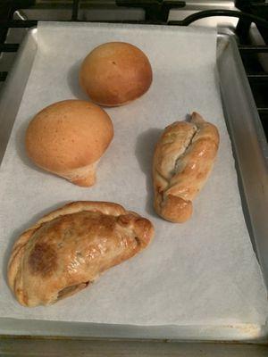 Pan de bono.  Top left.  Beef empanada and chicken. Baked