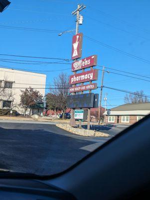 Sign from drive through.  you can see the corner of the hospital behind it